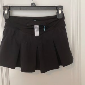 Girls Ivivva tennis skirt.